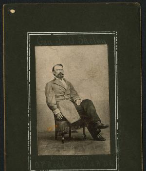 A black-and-white reproduction of a photograph of Confederate General Joseph Shelby is pasted onto a black card. The inscription reads "Compliments O.F. Redd Capt. A.A.D.C." and the card appears to feature General Shelby's signature. 