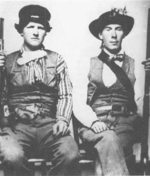 Two members of the Missouri State guard posing with rifles