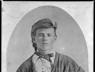 Black and white portrait of Bushwhacker, outlaw, and bank robber Jesse James, circa 1864.